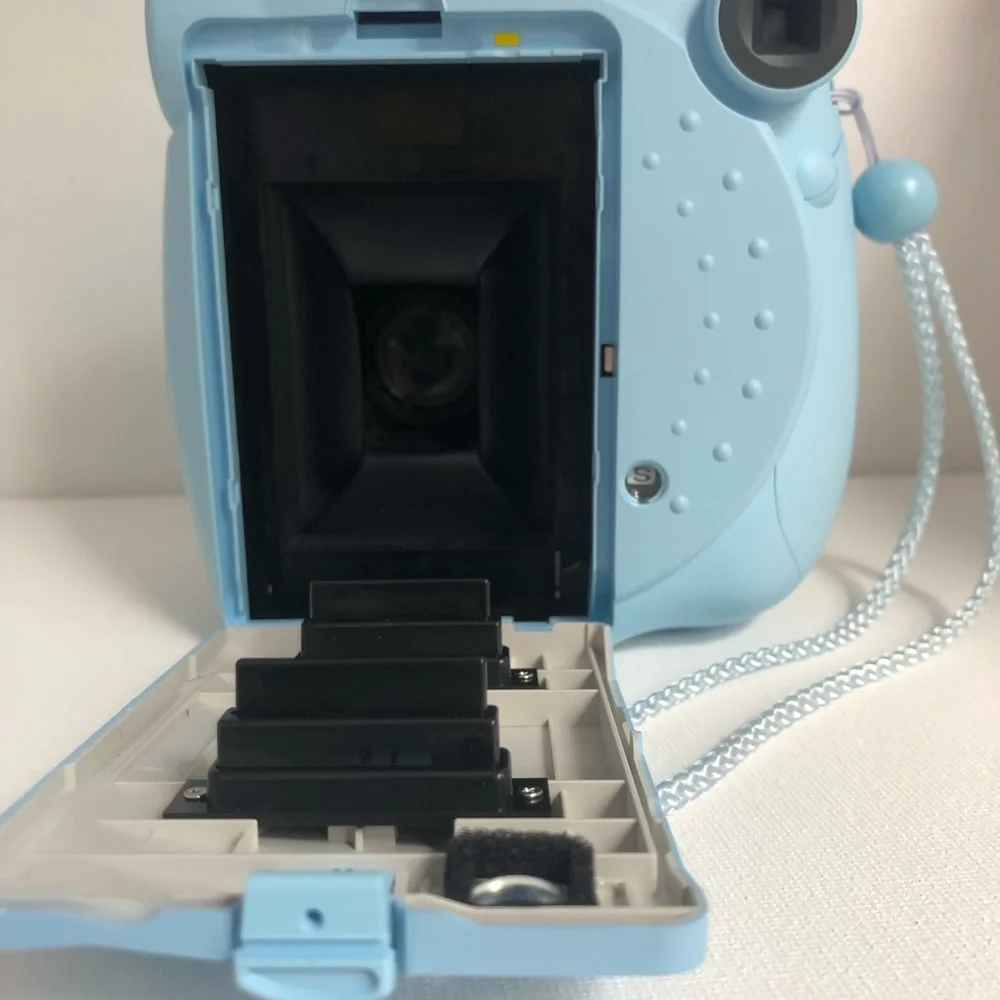 Blue instax mini 7s Polaroid camera